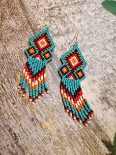 Beautiful long red earrings made of Czech beads.Length 4 inches (10cm).width 1 inch (3 cm).Hook-and-eye closure is hypoallergenic. Southwestern Fringe Jewelry With Round Beads, Southwestern Style Beaded Fringe Earrings For Gift, Southwestern Beaded Fringe Earrings As Gift, Southwestern Fringe Beaded Earrings As Gift, Bohemian Turquoise Tassel Earrings With Beaded Fringe, Turquoise Beaded Fringe Tassel Earrings For Festival, Southwestern Fringe Beaded Earrings For Gift, Southwestern Dangle Jewelry With Tassels, Red Bohemian Jewelry With Beaded Fringe