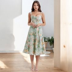 Floral Green Midi Dress that is a stunning vintage-inspired piece that features an off-shoulder design with a fitted corset bodice, perfect for those looking to embrace a feminine, romantic style. The soft green fabric adorned with floral prints gives the dress a fresh and summery feel, making it ideal for garden parties, weddings, or casual summer outings. The midi length adds elegance, while the flowing skirt ensures comfort and movement throughout the day. Whether you're dressing up for a spe Fitted Corset, Skirt Corset, Corset Midi Dress, Feminine Romantic, Floral Corset, Corset Bodice, Garden Parties, Flowing Skirt, Midi Dress Summer