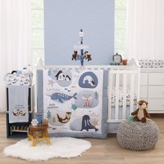 a baby crib bedding set with animals on it