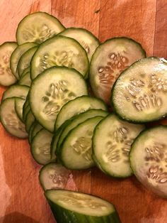 cucumber slices are arranged on a cutting board