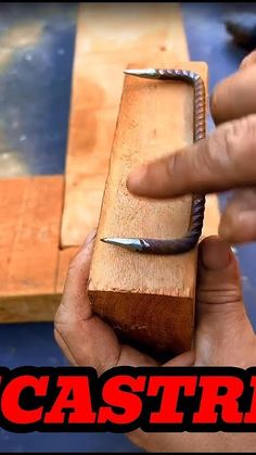 a person holding a wood block with a knife in it's hand and the caption reads, cast iron