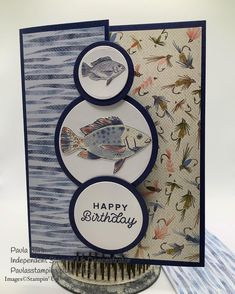 a close up of a card with two fish on it and the words happy birthday