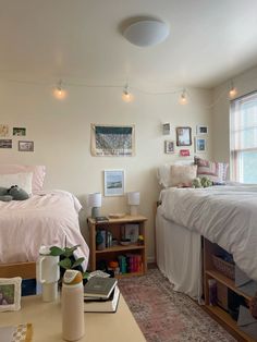 a bed room with a neatly made bed next to a window