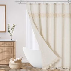 a bathroom with a bathtub, sink and shower curtain in front of a mirror