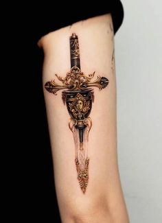 a woman with a cross tattoo on her arm