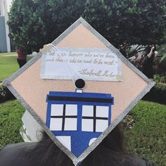 a person wearing a graduation cap decorated with a tardish