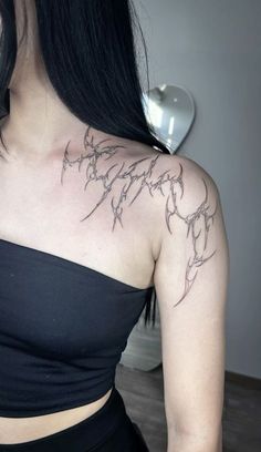 a woman with a tattoo on her chest