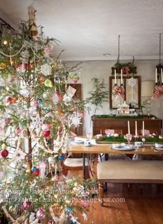 a decorated christmas tree in a dining room