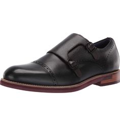 Classic Double Buckle Monk Shoe In Softly Burnished Leather With Zig Zag Counter Stitch Detail And Lightly Tumbled Leather Panels. Contemporary Layered Sole Featuring Ted Baker Geometric Tred. Moulded Footbed Printed With Seasonal Artwork. Padded Topline And Tongue Adding To All Day Comfort. Black Slip-on Monk Strap Shoes With Plain Toe, Black Wingtip Monk Strap Shoes With Branded Insole, Black Monk Strap Slip-on Shoes For Business Casual, Black Slip-on Monk Strap Shoes For Business, Black Leather Lined Monk Strap Shoes For Business Casual, Black Slip-on Monk Strap Shoes For Semi-formal Occasions, Black Wingtip Monk Strap Shoes With Leather Lining, Black Moc Toe Monk Strap Shoes For Business, Black Monk Strap Business Shoes With Moc Toe