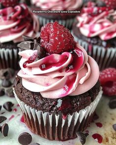 chocolate cupcakes with raspberries and cream frosting