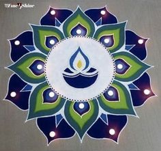 a blue and green flower with candles in the center on a gray background that says happy diwali