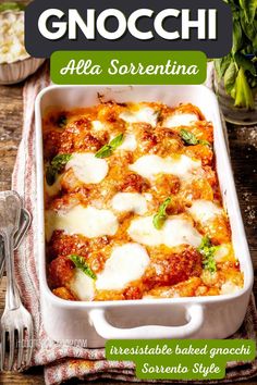 a casserole dish with cheese and spinach in it on a wooden table