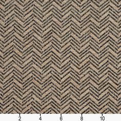 an upholstered fabric pattern with black and tan herringbones on the side