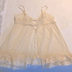 Brand New Never Used. Vintage And Classic Elegant Style Colors And Cut. Like A Like Cream Color Maybe Considered Off White/Beige. Beautiful And Stunning. Adjustable Straps And Closure In Back Feminine Sheer Cami Sleepwear, Delicate Lace Coquette Sleepwear For Loungewear, Coquette Delicate Lace Sleepwear For Loungewear, Sheer Camisole Chemise For Loungewear, Lace Chemise In Coquette Style For Loungewear, Sheer Lace Sleepwear, Sheer Lace Sleepwear For Bedtime, Victoria's Secret Coquette Lace Sleepwear, Sheer Lace Sleepwear For Sleepover