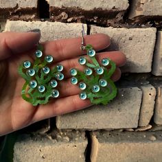 I'm not sure my picture does these justice. They are on beautiful green swirl acrylic with streaks of gold sparkles throughout. Thry have a perfect fun, creepy vibe. available in hypoallergenic stainless steel and sterling silver hooks for especially sensitive ears.2in long and 1.5in wide from bottom of the hook. Whimsical Green Hand Painted Earrings, Unique Green Pierced Earrings, Green Fun Plastic Jewelry, Fun Green Plastic Jewelry, Fun Green Nickel-free Earrings, Green Dangle Earrings With Fun Style, Artsy Green Earrings With Ear Wire, Fun Green Drop Earrings, Green Fun Drop Earrings