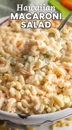 this macaroni salad is loaded with carrots, celery and mayonnaise