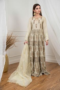 SKU: 1502 Price for Shirt, and Pants Soft khaddi flowy eight yards of fabric used in this ensemble with signature hand block print of Shireen Lakdawala. The ensemble is unique with hand embroidiery of gota pearl, resham and sequence work for any occasion. Dress it up with jewellery for any party or wedding wear. Shirt length 55. Model is wearing XS. Designer Chanderi Maxi Sets, Beige Raw Silk Sets With Dabka Details, Beige Raw Silk Dabka Sets, Beige Dabka Raw Silk Set, Cotton Traditional Wear With Resham Embroidery In Maxi Length, Bohemian Designer Mulmul Set, Designer Wear Beige Sets With Dabka Detailing, Designer Beige Sets With Dabka Details, Cream Dabka Sets For Transitional Season