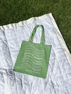 100% organic cotton tote bag, sustainable from start to finish. Perfect for a trip to the grocery store, a day at the beach or pool, shopping, walking around campus, and more! These totes are sturdy and built to last. I created this design digitally, and love the sweet message! All designs are printed on hand-dyed bags that are 16 inches (height) by 15 inches (width). Creative Tote Bag, Sweet Message, Green Tote, Sweet Messages, Garden City, My Sunshine, Bag Design, Cotton Tote Bag, You Are My Sunshine