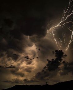 a lightning bolt hitting through the dark clouds