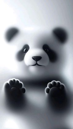 a black and white photo of a panda bear