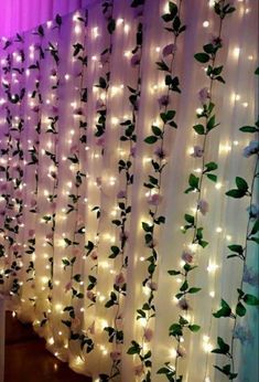 the curtain is decorated with flowers and lights