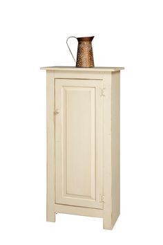 a white cabinet with a brown vase on top of it's door and bottom