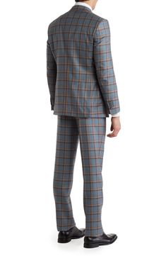 Give your reputation a clean slate with a modern tailored plaid suit featuring a sharp peak lapel jacket and flat front trousers. Jacket has peak lapels; chest welt pocket; patch pockets Trousers have zip fly with button closure; front slant pockets; back button-welt pockets 70% wool, 10% polyester, 20% viscose Dry clean Imported Model stats: 6'1" height, 32" waist. Model is wearing size 40R. Tailored Plaid Suit With Notch Lapel, Plaid Suits With Notch Lapel And Welt Pockets, Plaid Business Casual Suits With Lapel Collar, Plaid Suits With Lapel Collar For Business Casual, Plaid Lapel Collar Suits For Business Casual, Tailored Plaid Three-piece Suit For Work, Lapel Jacket, Clean Slate, Plaid Suit