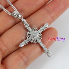 "LarkKing NE8318 Sterling silver cross necklace, flower cross necklace, unique cross pendant, cross for women, christian gift, christian cross Cross pendant: Sterling silver with zircon crystal, white gold plating Size: 1 1/8\" x 1 7/16\" Weight: 3.7g Chain: Sterling silver, white gold plating To select Sterling Silver Chain Style and Length from a drop down menu: Figaro chain: 16\", 18\", 20\", 22\". 4-Square chain: 16\", 18\". Spiga chain: 16\", 18\", 20\" Box chain: 16\", 18\", 20\", 22\", 24 Sterling Silver Cross Necklace For Wedding, Opal Moon Necklace, Equestrian Necklace, Handwriting Necklace Custom, Compass Jewelry, Handwriting Necklace, Gold Moon Necklace, Silver Cross Necklace, Custom Initial Necklace