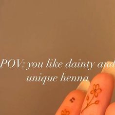 a person's hand with two small flowers on it and the words pov you like dairy and unique henna