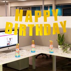 an office cubicle decorated with birthday decorations