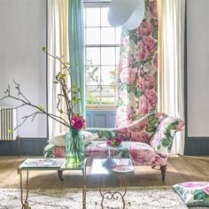 a living room filled with furniture and flowers