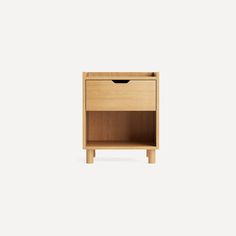 a small wooden nightstand with one drawer open