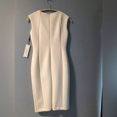 Calvin Klein Ivory Dress With Gold Hardware. Brand New! Calvin Klein White Midi Dress For Formal Occasions, Classic White Sheath Midi Dress, Elegant White Calvin Klein Dress, Calvin Klein White Midi Length Dress, Calvin Klein White Midi Dress, Classic White Sheath Mini Dress, Elegant White Calvin Klein Midi Dress, Fitted White Calvin Klein Mini Dress, Fitted White Calvin Klein Midi Dress