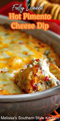 a casserole dish with cheese on top and the words, fully loaded hot pineno cheese dip