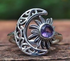 ☾Handmade, Natural Amethyst Sterling Silver Detailed Moon & Sun Ring Size 6.5☾ ❤︎Featured in this listing is a sterling silver, handmade, natural stone ring. This lovely ring features a beautiful, Natural Purple Amethyst Moon round stone. The round Amethyst gemstone has been bezel set into Sun within a handmade, detailed Crescent Moon Ring setting. ❤︎Highly polished smooth 2mm band, with the size of the detailed moon at 16x14mm ❤︎100% Natural untreated stone Stone: Natural Amethyst (5mm) Metal: Celestial Amethyst Moon Phase Jewelry, Celestial Moon Phase Amethyst Jewelry, Silver Amethyst Moon Phase Jewelry, Silver Amethyst Jewelry With Moon Phase, Celestial Purple Round Jewelry, Purple Celestial Round Jewelry, Bohemian Sterling Silver Rings With Sun And Moon Design, Bohemian Amethyst Crystal Ring, Celestial Round Amethyst Jewelry