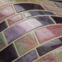 a close up view of a vase with many different designs on it's surface