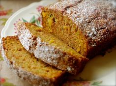 some type of cake on a plate with powdered sugar