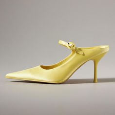 Add a pop of color with these yellow pointed toe stiletto heel mules featuring a stylish buckled strap for a touch of sophistication and flair. Perfect for chic, statement-making looks. Color: Yellow Heel Type: Stiletto heel Heel Height: 3.5'' / 89 mm approx Product measurements were taken using size 8. Please note that measurements may vary by size. Toe: Pointed toe Buckled strap design Handcrafted US sizing. Fits true to size. Spring Pointed Kitten Heels With 4-inch Heel, Pointed 4-inch Heels For Summer, Summer Pointed 4-inch Heels, Pointed 4-inch Kitten Heels For Spring, Spring Pointed 4-inch Kitten Heels, Pointed Heels With Heel Strap For Spring, Spring Pointed Heels With Heel Strap, Spring Party Pointed Heels, Chic Pointed Heels For Summer