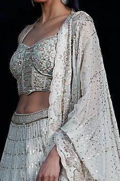 Grey lehenga with an attached cancan, linear, floral, scalloped pattern embroidery using thread work, moti, sequin and cut pipes. Comes with matching embroidered padded and matching embroidered dupatta. - Aza Fashions Grey Lehenga, Sequin Lehenga, Embroidered Dupatta, Pattern Embroidery, Thread Work, Set Women, Grey Floral, Aza Fashion, Lehenga