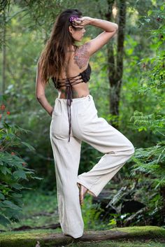 Our Hand-Made Natural Cotton Harem Pants are made with soft and breathable 100% hand-woven khadi cotton, these trousers are super comfortable making them perfect for yoga, festivals, and day-to-day earth dwelling. Unisex, featuring two pockets and a string tie for a personalized fitting. Measurements:S/Mwaist: 88cmLeg length: 106 cmHip to groin: 32 cmM/Lwaist: 90 cmLeg length: 108 cmHip to groin: 34cm L/XLwaist: 92 cmLeg length: 109 cmHip to groin: 35 cm Hand made with Love ❀ Bohemian Straight Leg Harem Pants For Beach, Cotton Tapered Leg Pants For The Beach, Cotton Tapered Leg Pants For Beach, Relaxed Fit Conscious Cotton Bottoms, Hippie Style Straight Cotton Pants, Cotton Hippie Straight Pants, Hippie Cotton Straight Pants, Festival Relaxed Fit Straight Leg Bottoms, Hippie Cotton Bottoms For Meditation