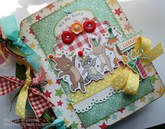 a close up of a greeting card with buttons and ribbons on it's side