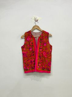 Colorful Sleeveless Phulkari Jacket, Traditional Indian Phulkari Vest, Sleeveless Ethnic Jacket For Women, Gift For Her Product Detail Color:- As Shown In Picture Material:- Fulkari, Embroidered, Cotton Length:- 23inch / 60cm Bust:- 40inch / 102cm Arm Hole:- 10inch / 52cm NOTE : Product color may slightly vary due to photographic lighting sources or your monitor settings. Bohemian Sleeveless Vest With Floral Embroidery, Sleeveless Bohemian Vest With Floral Embroidery, Traditional Sleeveless Cotton Outerwear, Sleeveless Festival Outerwear, Folk Style Multicolor Vest For Spring, Embroidered Multicolor Vest For Festivals, Folk Style Multicolor Festival Vest, Traditional Sleeveless Vest For Festive Occasions, Traditional Sleeveless Festive Vest