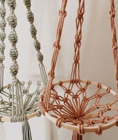 two macrame hangings with ropes attached to them