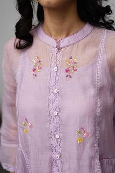 Pastel lilac kurta with all-over floral embroidery, lace detailing, mandarin collar and button placket. Comes with pant and inner slip.
Component: 3
Embroidered
Neckline: Mandarin Collar
Sleeve Length: Three Quarter
Fabric: Kurta: Chanderi Pant and Inner Slip: Cotton
Color: Purple
Gathers at the side
Asymmetric hem
Lace trim sleeves and straight fit pant - Aza Fashions Purple Sets With Floral Embroidery, Traditional Lace Trim Set For Spring, Lavender Cotton Sets For Spring, Fitted Lavender Embroidered Sets, Embroidered Fitted Lavender Sets, Traditional Spring Sets With Lace Trim, Purple Chikankari Embroidery Sets, Spring Embroidered Lace Set, Purple Chikankari Embroidery Sets For Summer