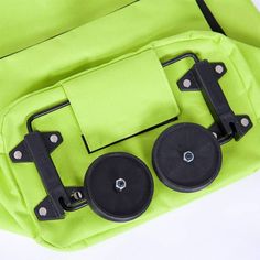 an open green bag with two black wheels