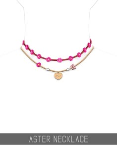 a necklace with pink flowers and hearts on the front, along with a gold heart charm