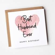 a card with the words best husband ever written on it and a pink heart in the middle