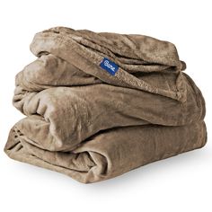 two blankets stacked on top of each other with the word's blue label in it