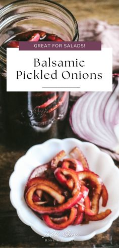 a bowl filled with sliced onions next to a jar of balsamic pickled onions