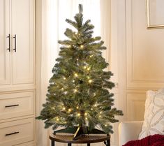 a small christmas tree in a living room